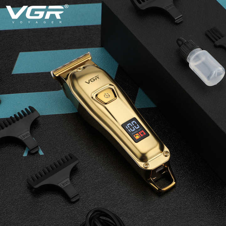 ماشین اصلاح موی سر و صورت وی جی آر مدل V-965 با تیغه استیل ضد زنگ، قابلیت اصلاح با شماره صفر، تنظیم سرعت، شانه قابل تنظیم و باتری 600 میلیآمپر ساعت با شارژ USB و طراحی ارگونومیک و مقاوم در برابر لغزش