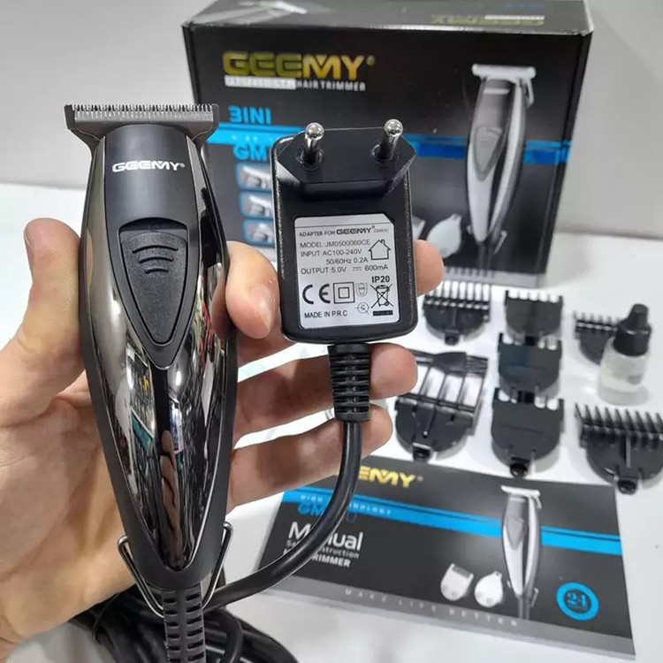 ماشین اصلاح موی سر و صورت جیمی مدل GM-830 با تیغه استیل ضد زنگ، برش مستقیم، قابلیت تنظیم سرعت، 7 شانه اصلاح از 0.2 تا 9 میلیمتر، وزن 200 گرم و منبع تغذیه برق با آداپتور
