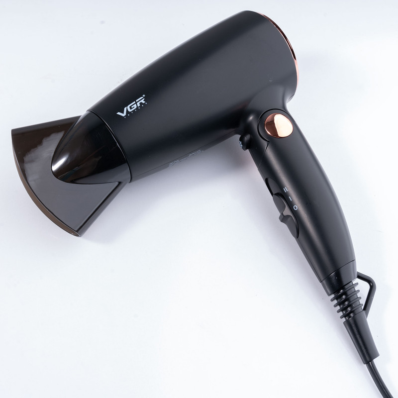 سشوار مسافرتی 1600 وات وی جی ار مدل V-439، موتور DC، وزن 300 گرم، المنت فلز، دارای سری متمرکزکننده باریک با ویژگی حجمدهندگی، با قابلیت باد سرد
